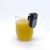 Liquid Level Indicator on the lip of a glass filled with orange juice