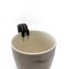 Liquid Level Indicator sitting on the lip of a cup - birds eye view