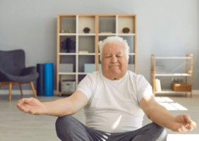 Elderly man doing yoga