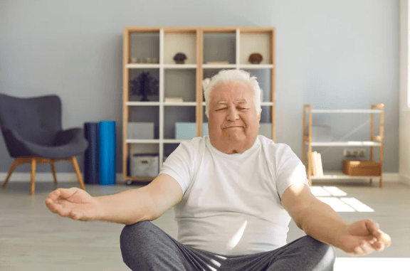 Elderly man doing yoga