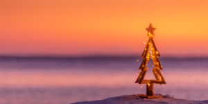 Christmas tree at the beach at sun set