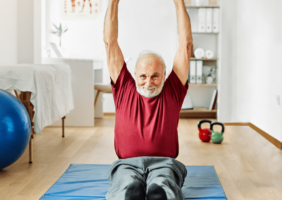 Elderly Man working out in his home