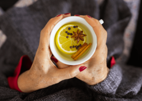 Elderly woman drinking herbal tea