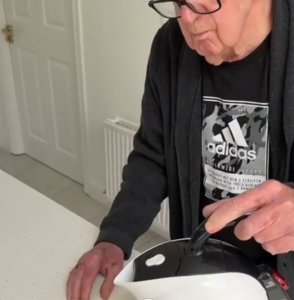 Elderly man pouring the Uccello Kettle 