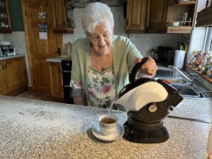 Mother making tea with her Uccello Kettle