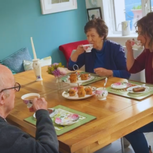 Ciara Turley sitting with her parents enjoying a cup of tea