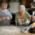 Mother making tea with Uccello Kettle and daughter drinking hers