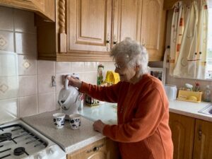 Elderly woman making tea with Uccello Kettle