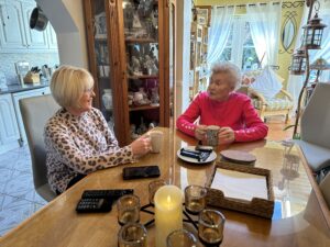Mother and daughter enjoy a cup of tea together in the dining room