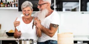 Elderly couple preparing dinner in the kitchen