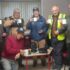 Local Men's Shed Group Photo - 7 Men's Shed Members Circle around the Uccello Kettle and enjoy a cup of tea together